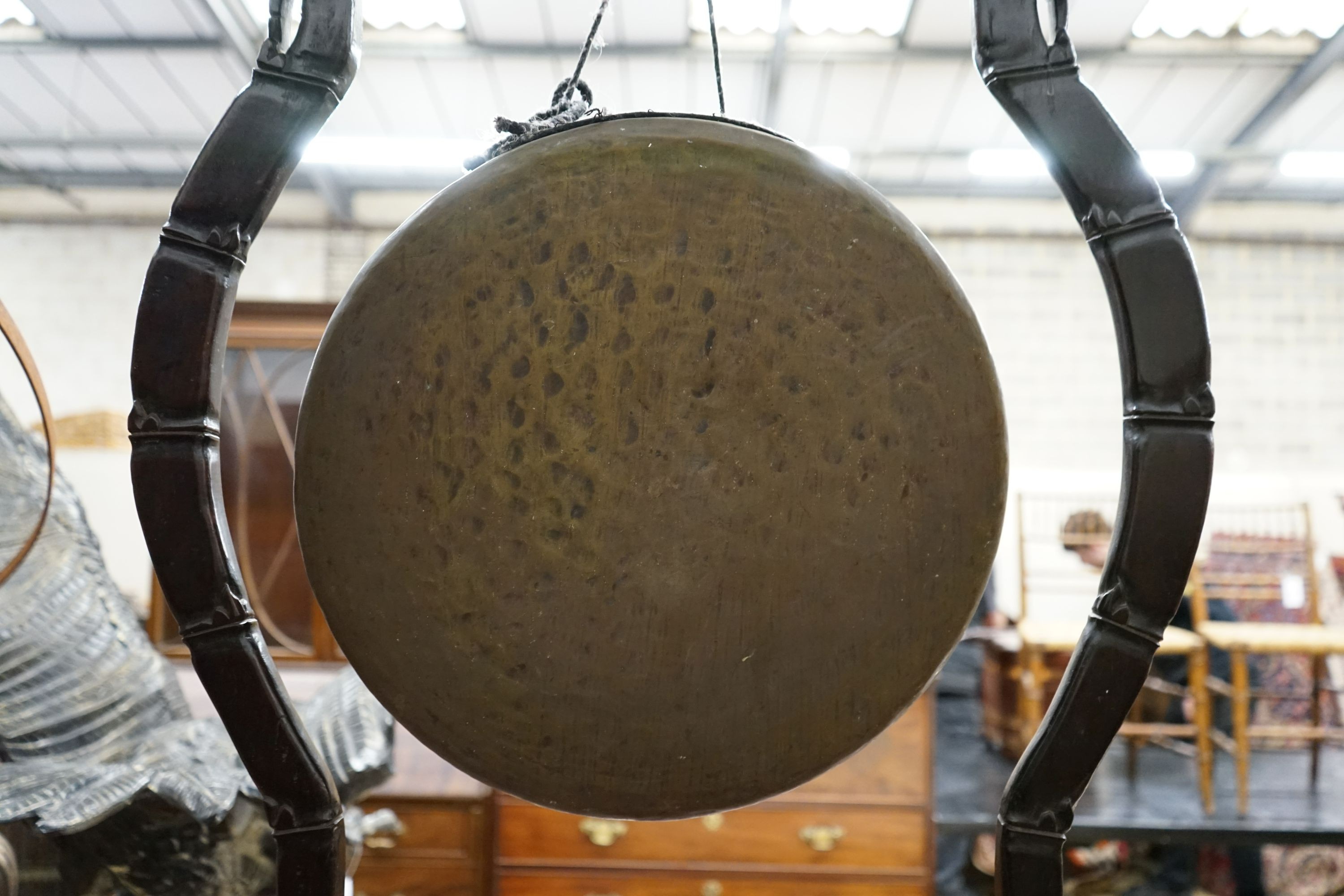 A Chinese carved hardwood gong on stand with beater, width 62cm, height 106cm